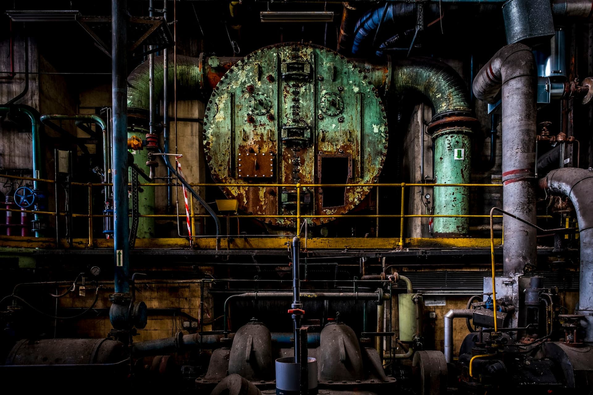 Interior of an industrial plant with pipework and machinery