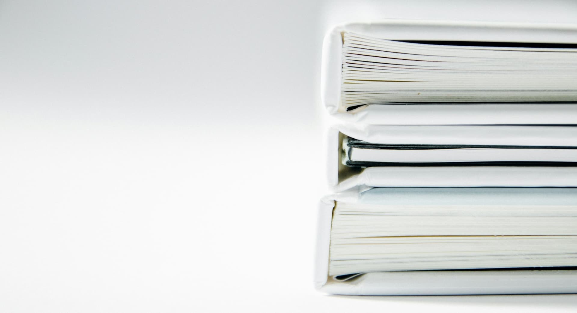 A neat stack of document folders